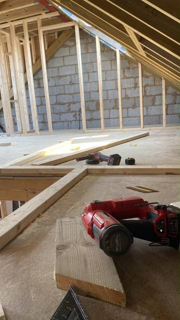 Loft conversion framing with new stud walls and floor